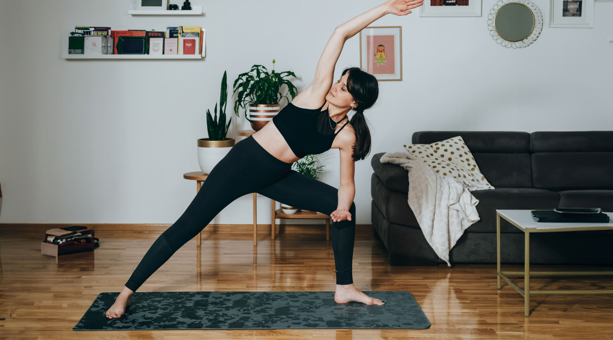Woman practising yoga at home